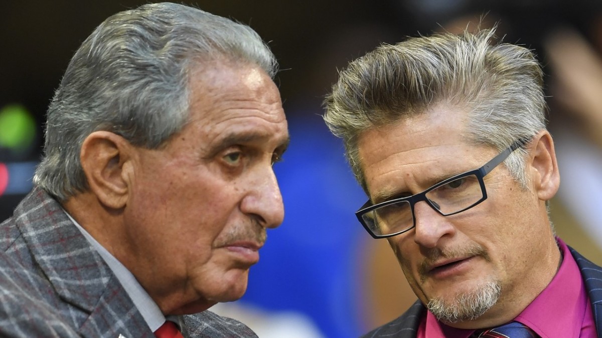 Falcons owner Arthur Blank (left) and Dimitroff talk on the sidelines during a game against the Los Angeles Rams. 